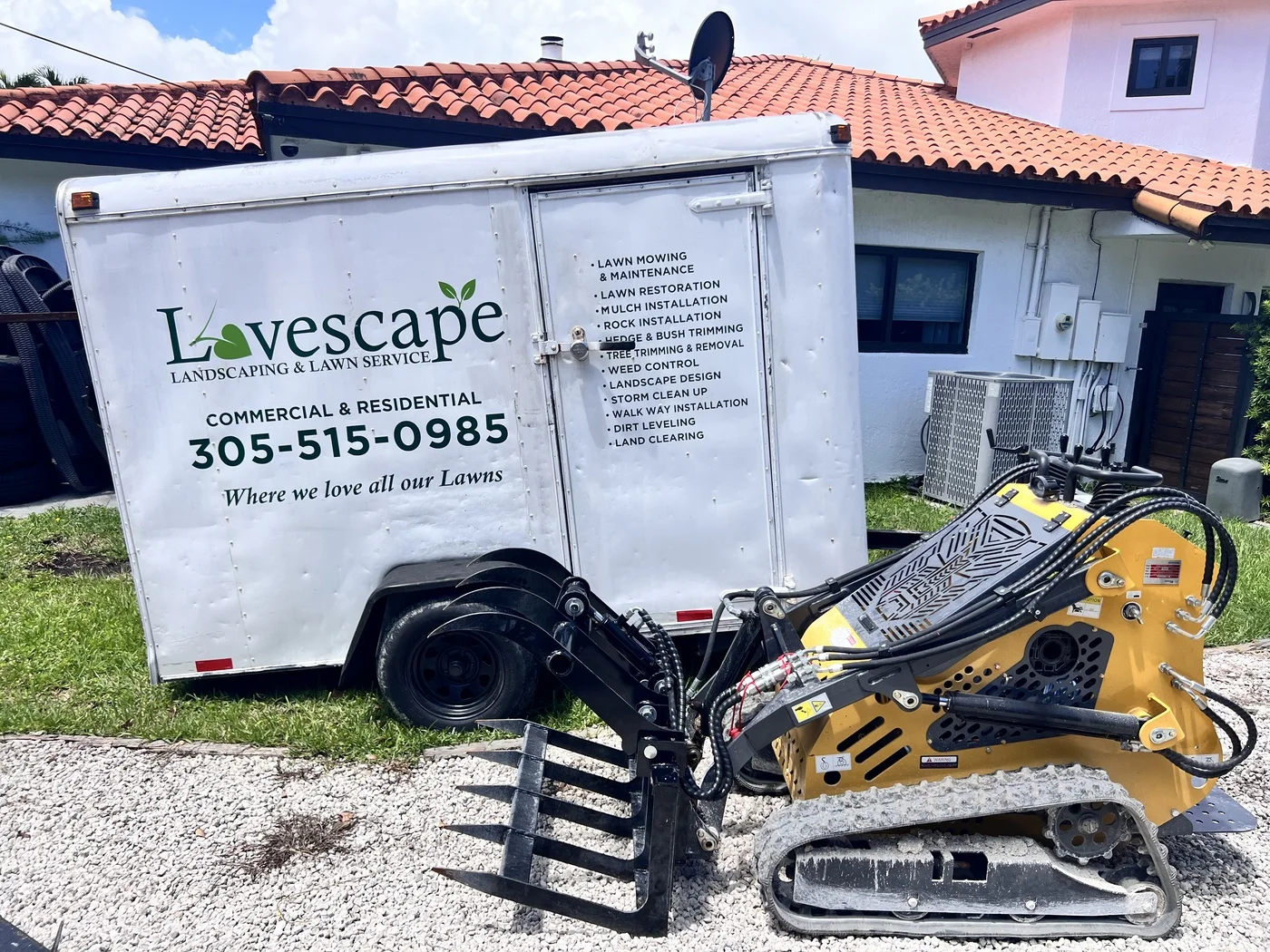 Mini skid steer with grapple attachment for land clearing and grading in Cutler Bay, FL